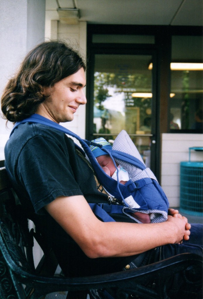 Babywearing Dad and newborn in Snugli